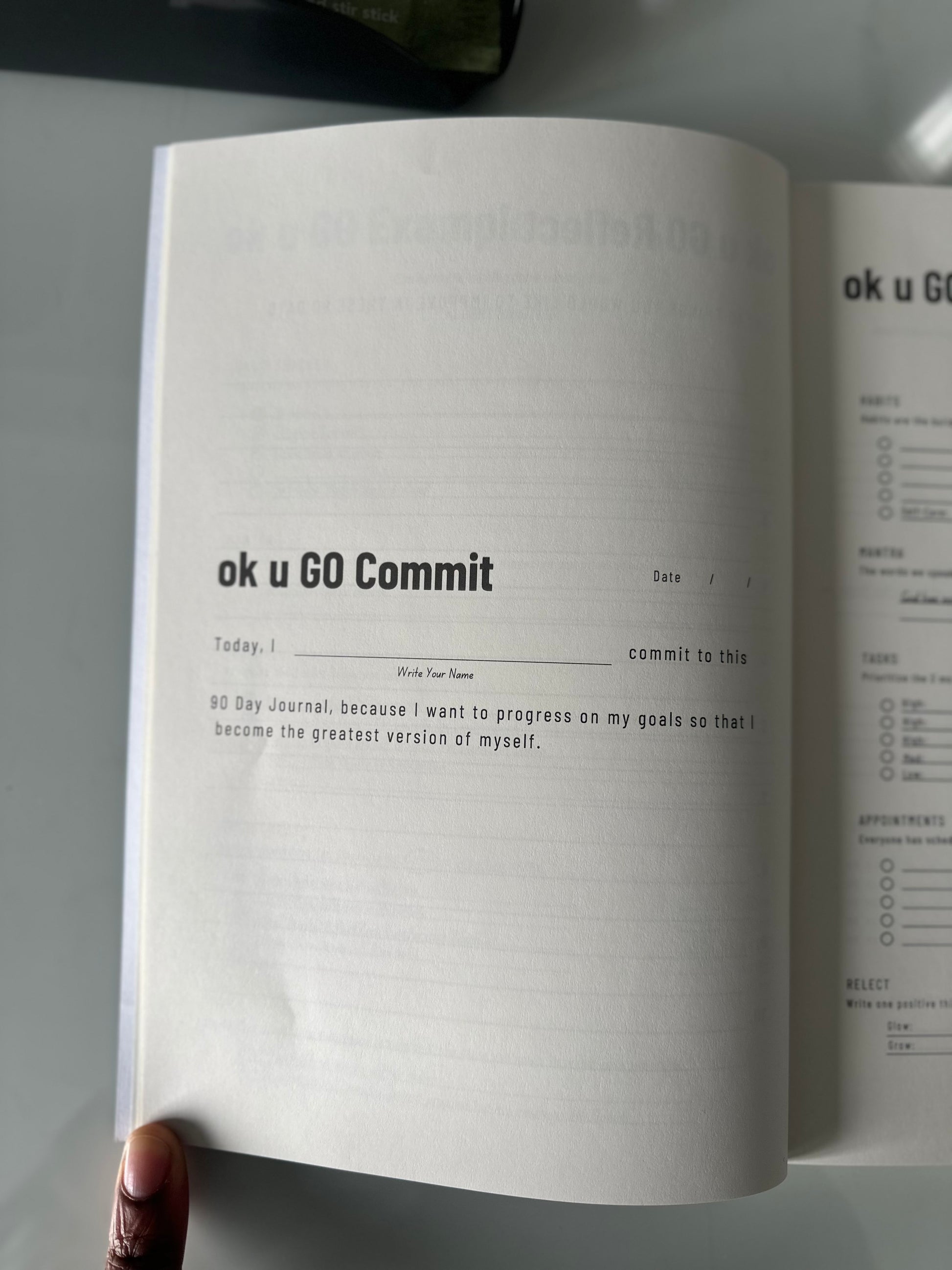 The commitment  page of The "Ok U Go Manifest 90 Day Journal" by Amobi Okugo.